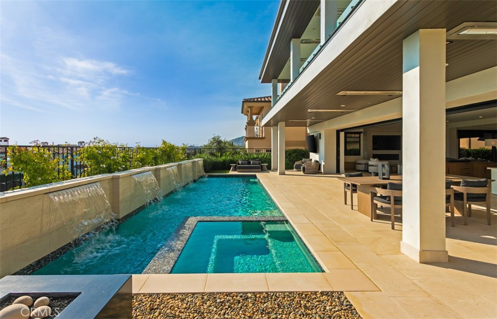 75 Ritz Cove Drive Dana Point, CA 92629 - Photo 40 of 49 a view of a swimming pool with a patio