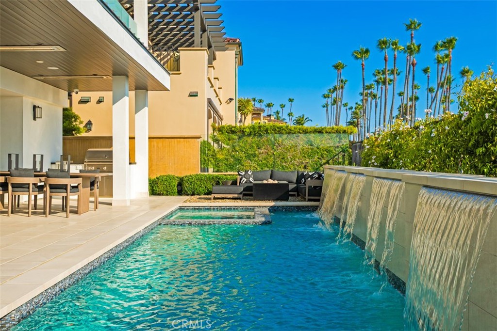 75 Ritz Cove Drive Dana Point, CA 92629 - Photo 42 of 49 a view of swimming pool with outdoor seating and plants