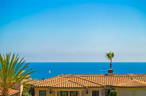 an aerial view of residential building and ocean