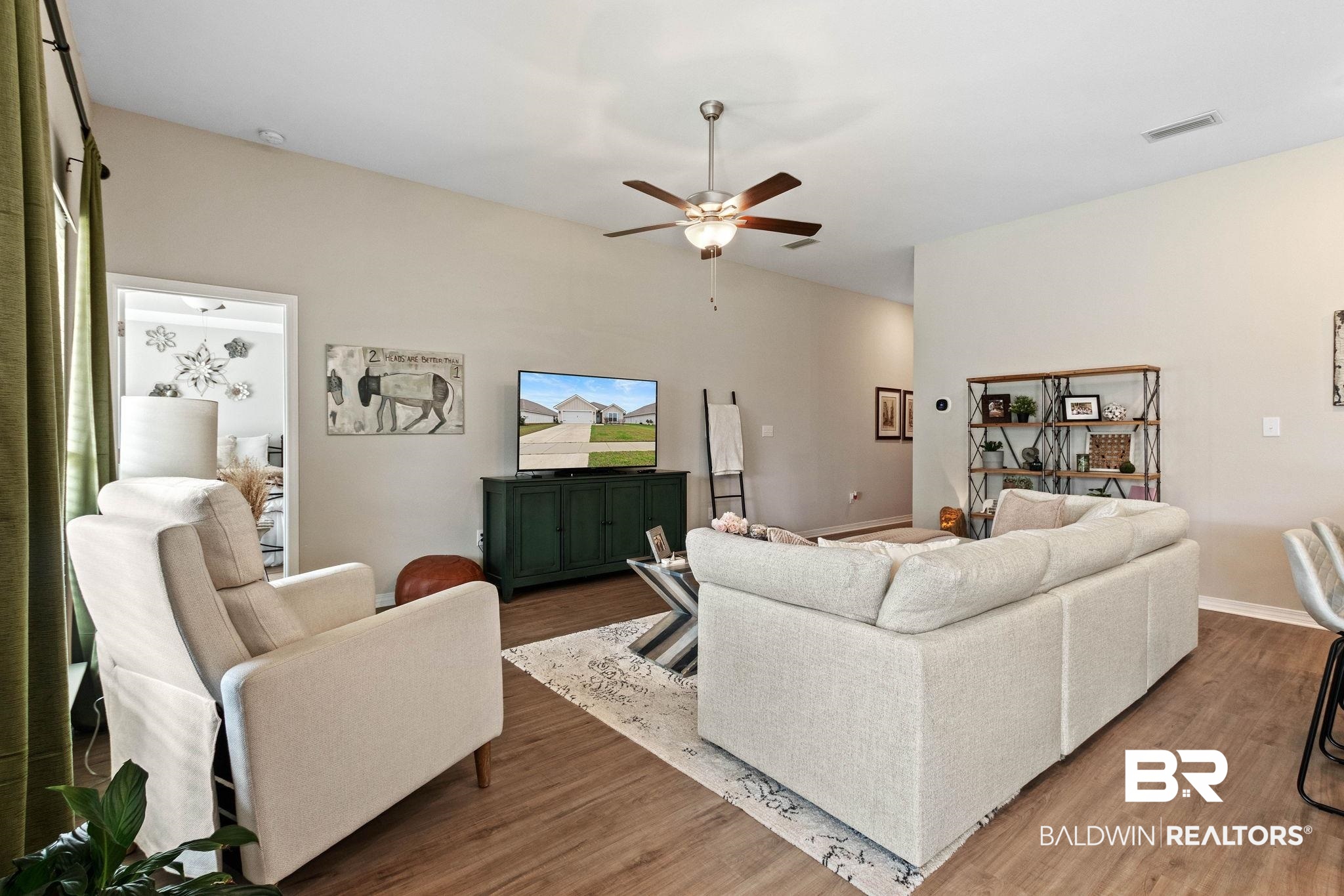 1203 Hayward Loop Foley, AL 36535 - Photo 8 of 41 Living area featuring a ceiling fan and wood finished floors