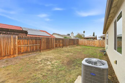 a house view with a backyard space