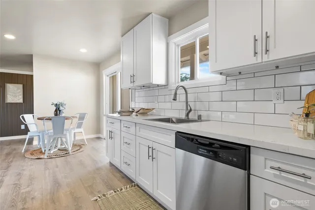 a kitchen with a sink and cabinets