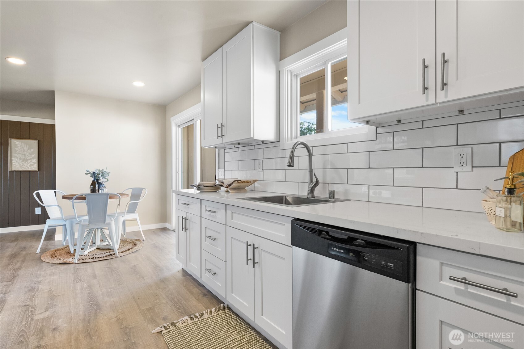 18008 202nd Street East Orting, WA 98360 - Photo 11 of 35 a kitchen with a sink and cabinets