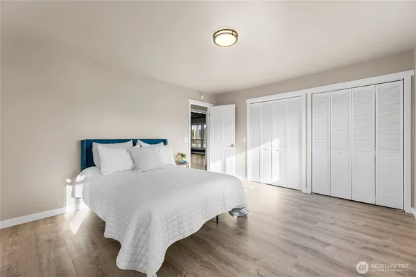 a large white bed in a white room