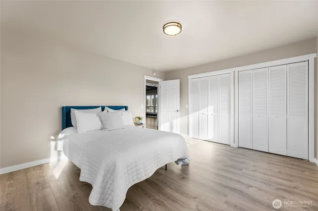 a large white bed in a white room