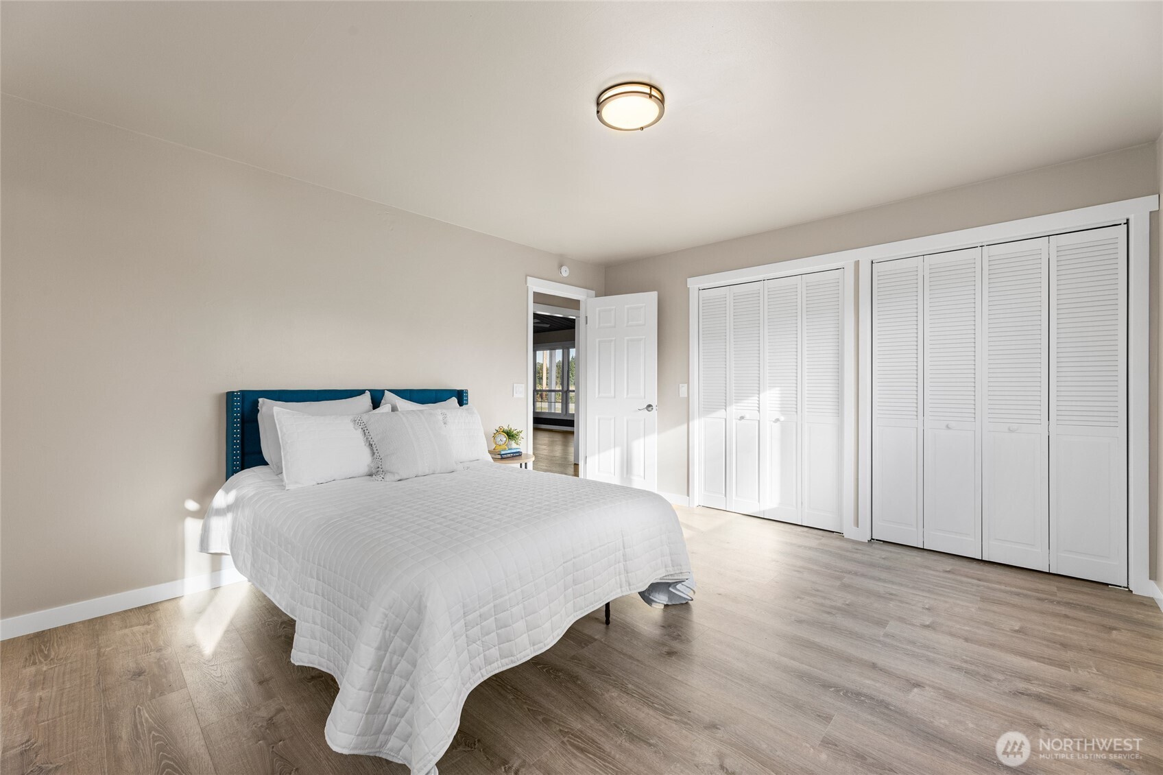 18008 202nd Street East Orting, WA 98360 - Photo 22 of 35 a large white bed in a white room