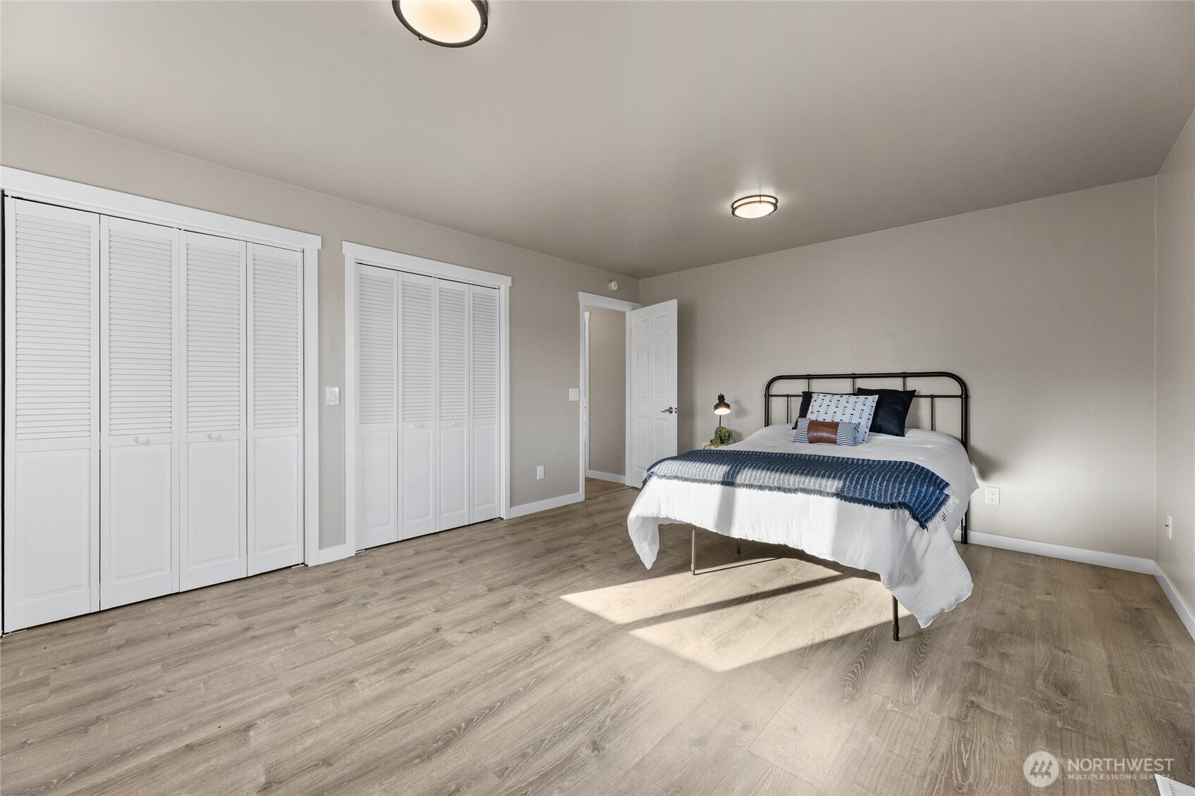 18008 202nd Street East Orting, WA 98360 - Photo 24 of 35 a bedroom with a bed and a mirror