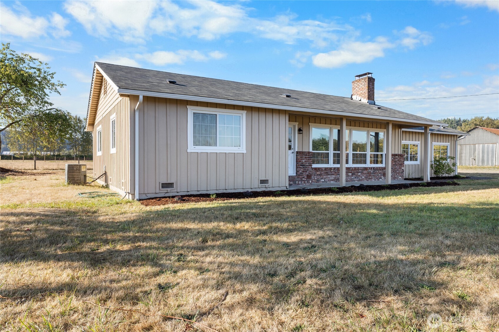 18008 202nd Street East Orting, WA 98360 - Photo 26 of 35 a front view of a house with a garden