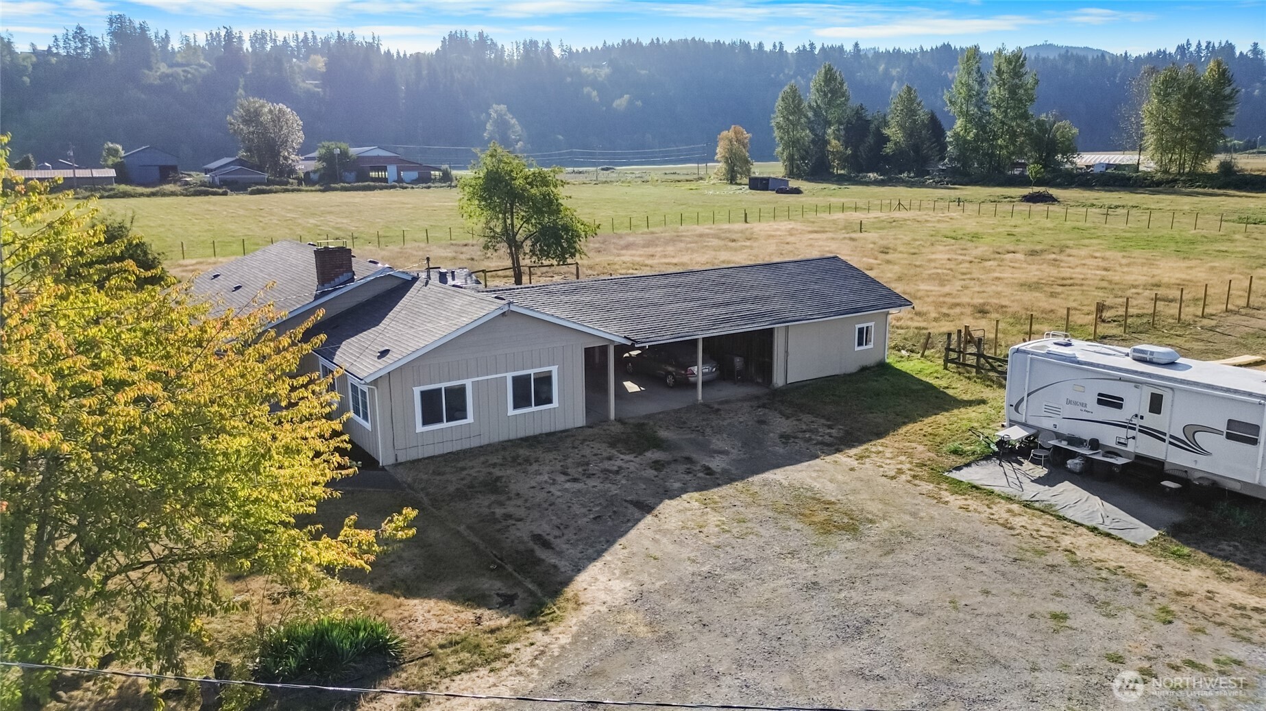 18008 202nd Street East Orting, WA 98360 - Photo 33 of 35 an aerial view of a house with a yard and lake view