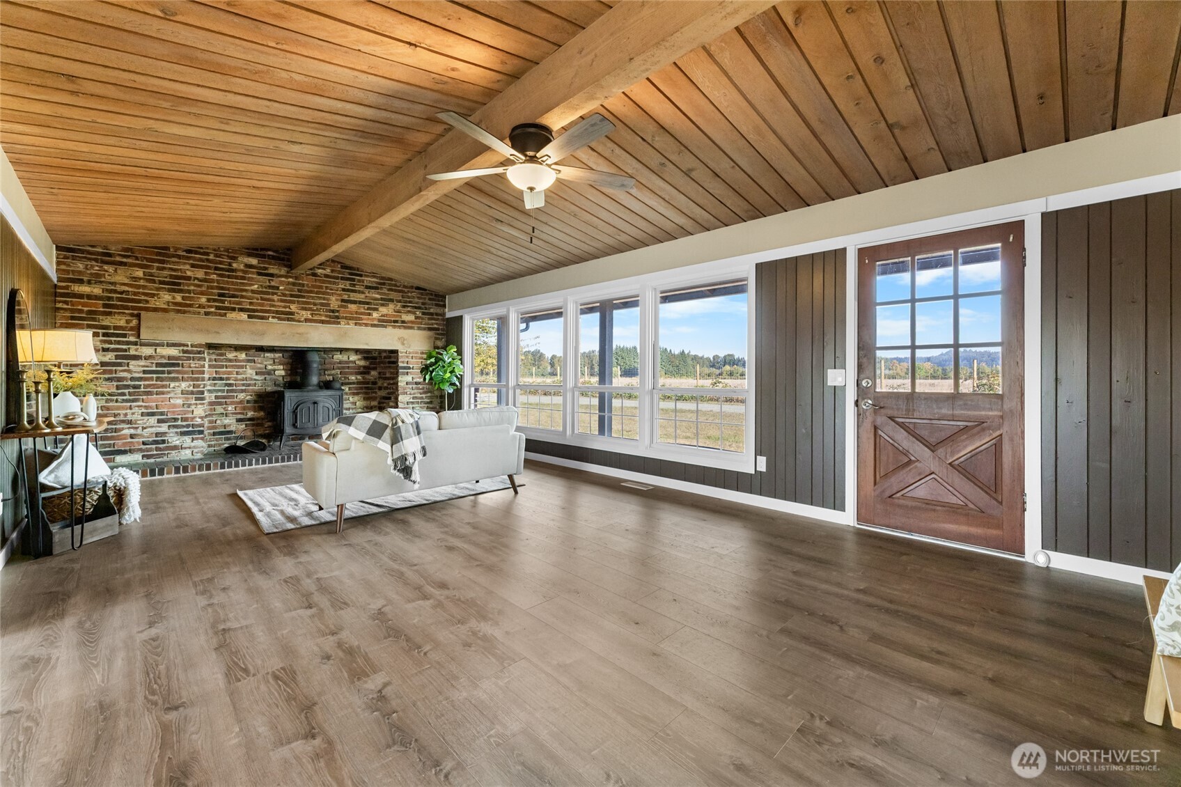 18008 202nd Street East Orting, WA 98360 - Photo 4 of 35 a view of a livingroom with furniture wooden floor and a ceiling fan