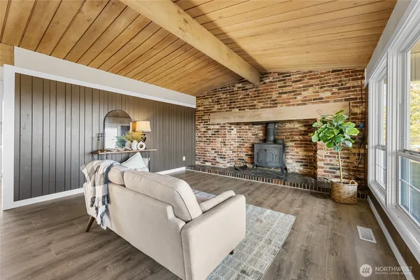 a view of a porch with furniture and a backyard