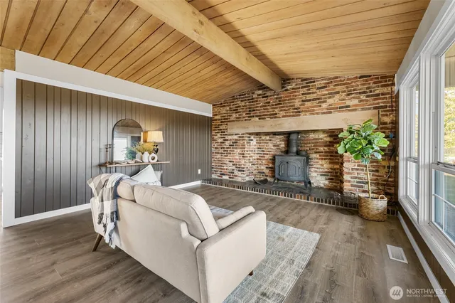 a view of a porch with furniture and a backyard
