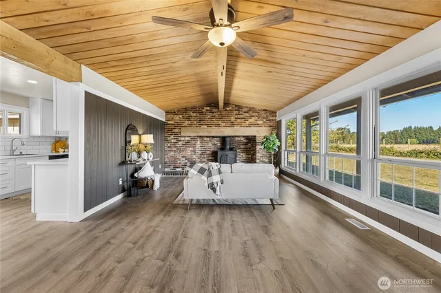 a view of a dining room with furniture wooden floor and chandelier