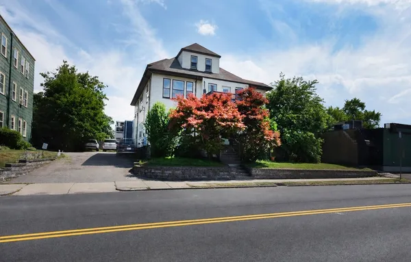 a front view of a house with a yard
