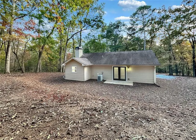 a house view with a backyard space