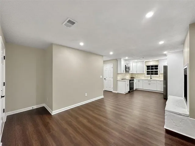 a view of kitchen with wooden floor