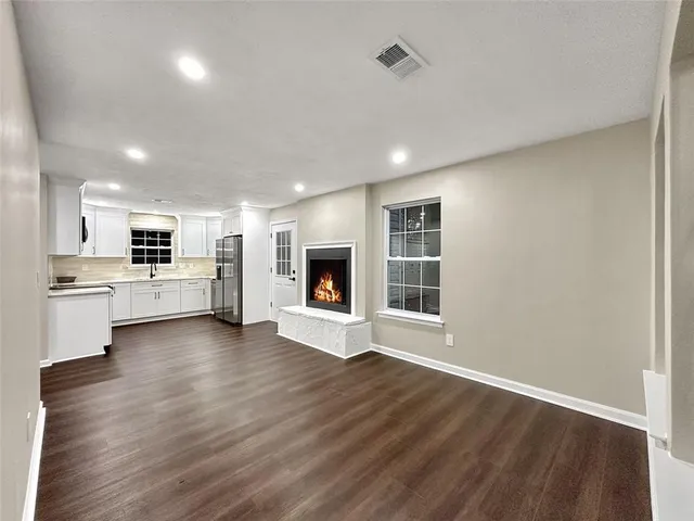 a view of kitchen with furniture and wooden floor