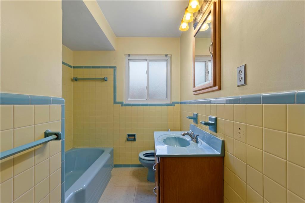 461 Eicher Road Pittsburgh, PA 15237 - Photo 13 of 28 a bathroom with a sink a toilet and mirror