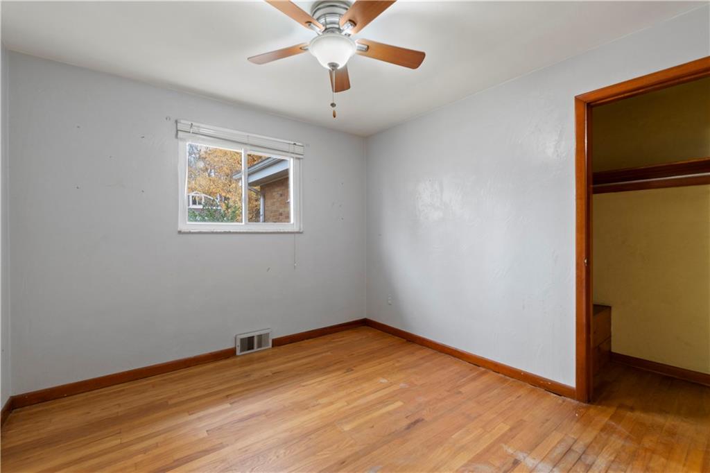 461 Eicher Road Pittsburgh, PA 15237 - Photo 14 of 28 wooden floor in an empty room with a window
