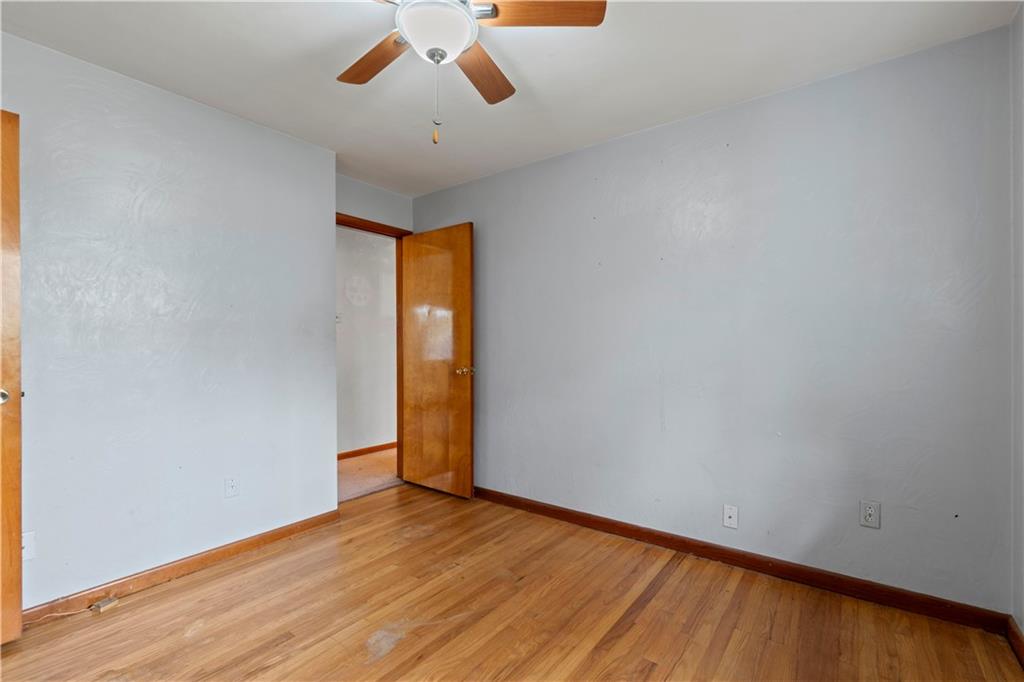 461 Eicher Road Pittsburgh, PA 15237 - Photo 15 of 28 a view of empty room with wooden floor and fan