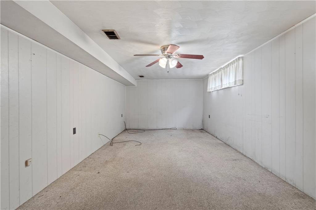 461 Eicher Road Pittsburgh, PA 15237 - Photo 26 of 28 an empty room with chandelier fan and windows