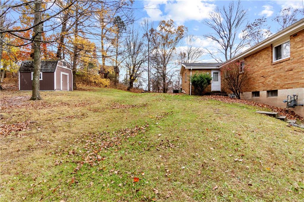 461 Eicher Road Pittsburgh, PA 15237 - Photo 4 of 28 a backyard of a house with large trees