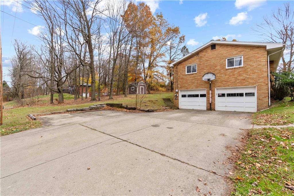461 Eicher Road Pittsburgh, PA 15237 - Photo 6 of 28 a front view of a house with a yard