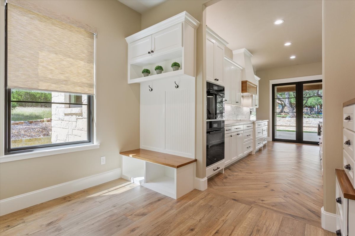 309 Highland Spring Lane Georgetown, TX 78633 - Photo 16 of 40 Just before the kitchen is a great Mud Room area for your shoes and raincoats...