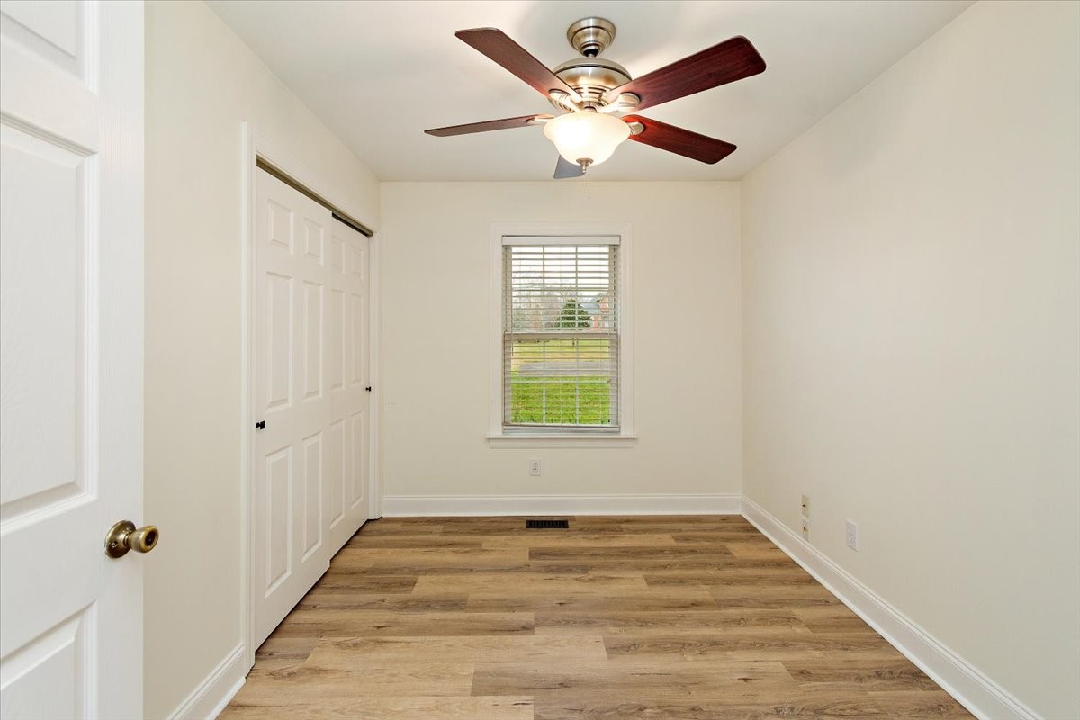 183 Gilliam Lane Tullahoma, TN 37388 - Photo 12 of 28 wooden floor in an empty room with a window