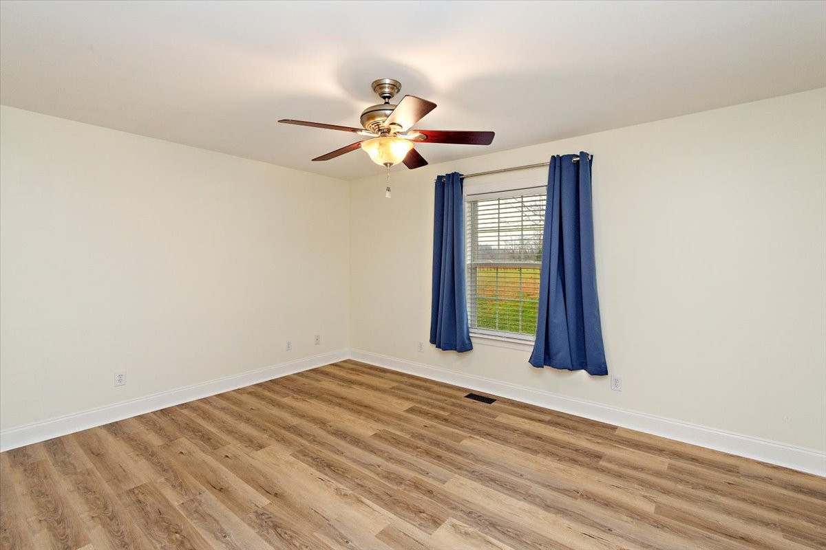 183 Gilliam Lane Tullahoma, TN 37388 - Photo 13 of 28 a view of a room with a ceiling fan and a window