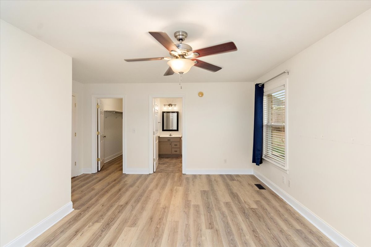 183 Gilliam Lane Tullahoma, TN 37388 - Photo 16 of 28 a view of an empty room with window and wooden floor