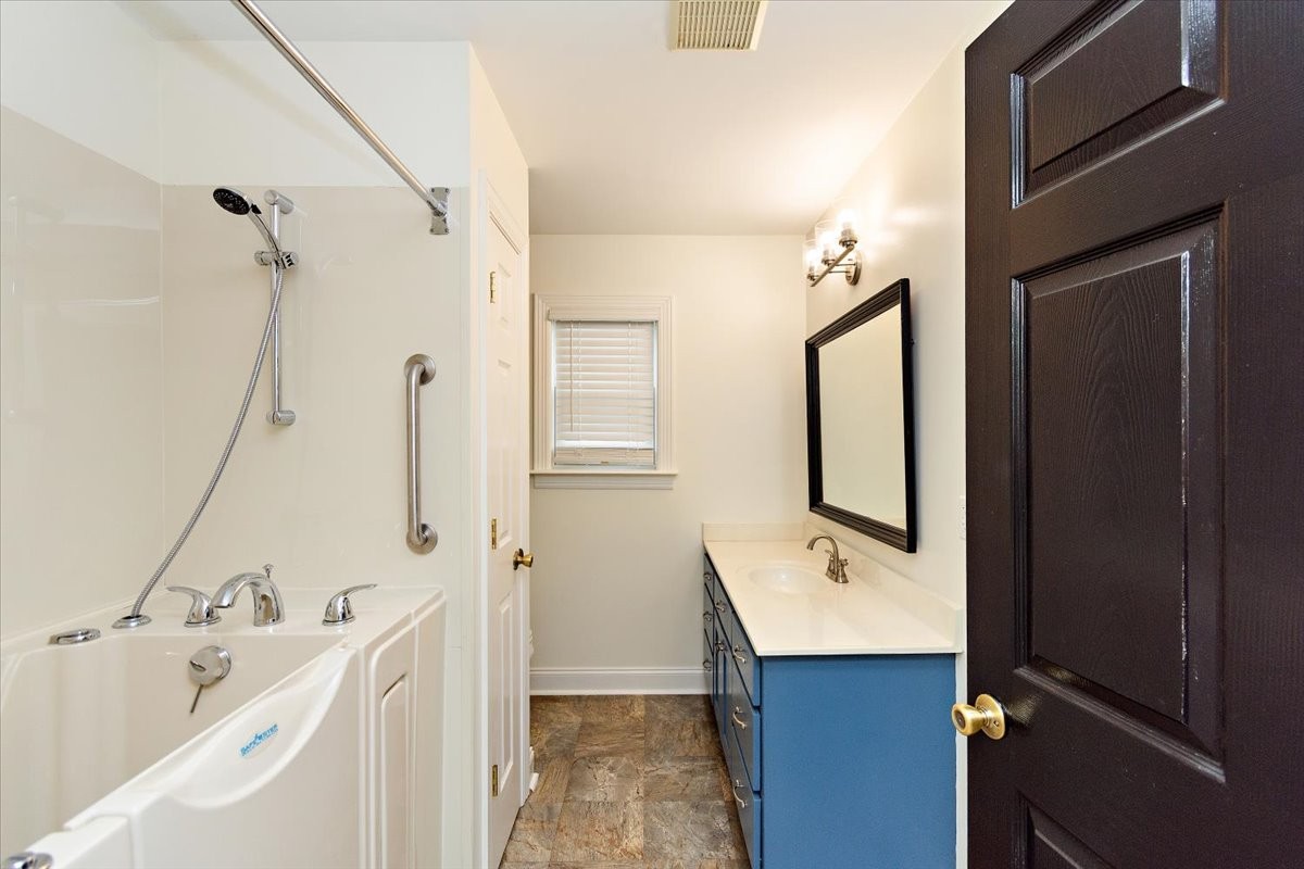 183 Gilliam Lane Tullahoma, TN 37388 - Photo 18 of 28 a bathroom with a double vanity sink and mirror