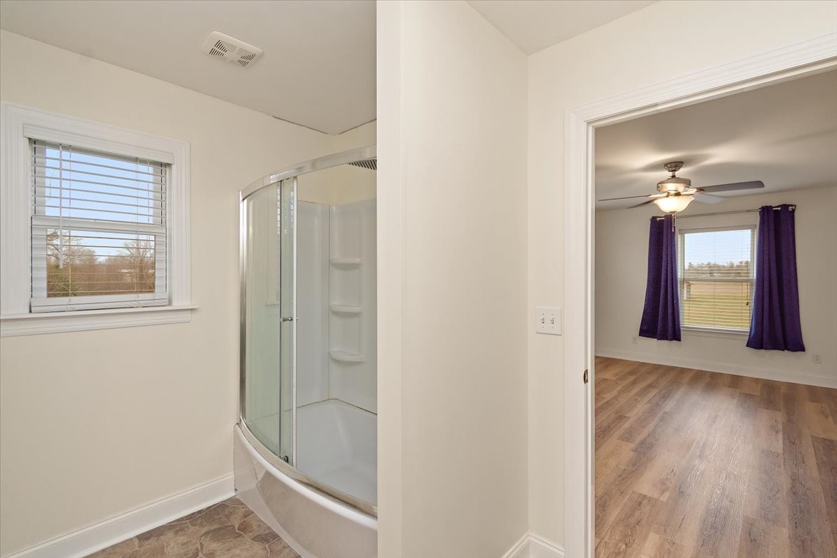 183 Gilliam Lane Tullahoma, TN 37388 - Photo 19 of 28 a bathroom with a bathtub and a shower