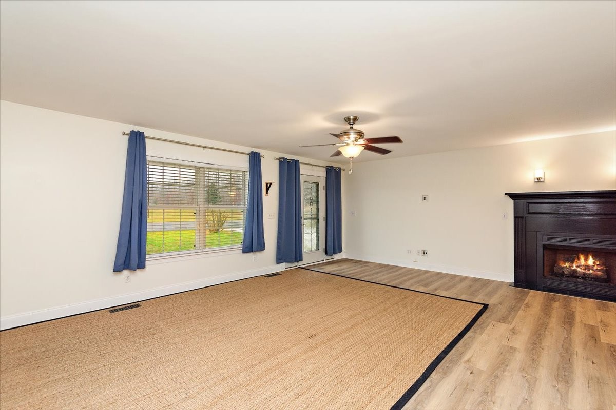 183 Gilliam Lane Tullahoma, TN 37388 - Photo 5 of 28 a view of an empty room with a fireplace and a window