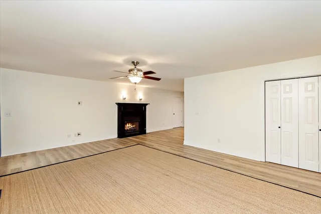 a view of an empty room with a fireplace