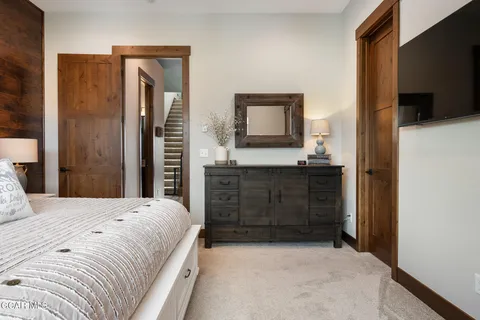 a bedroom with a bed and window