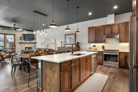 a kitchen with a sink cabinets and stainless steel appliances