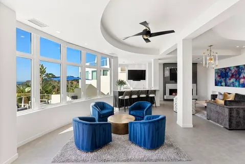 a living room with furniture and flat screen tv