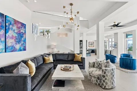 a living room with furniture and a rug