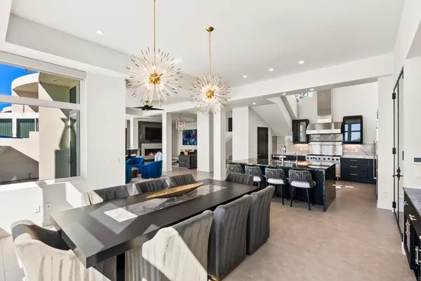 a large kitchen with a table and chairs