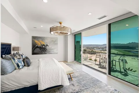 a bedroom with a bed and a television