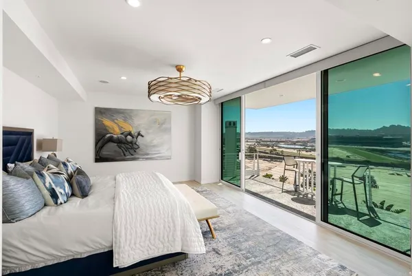 a bedroom with a bed and a television