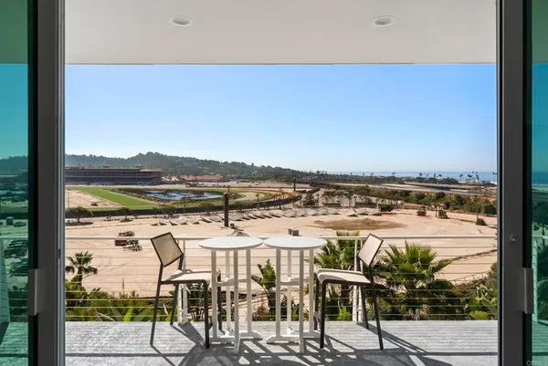 a view of a balcony with an ocean view