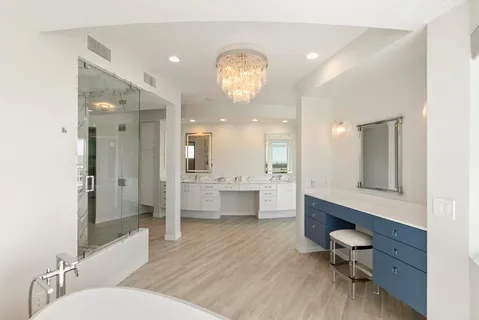 a bathroom with a toilet sink and a mirror