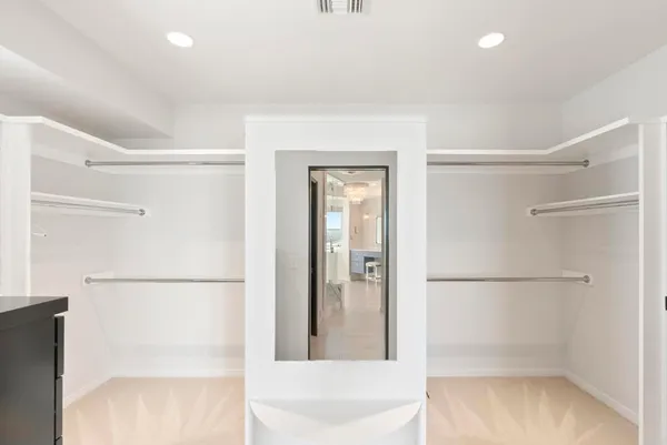 a bathroom with a shower and a glass door