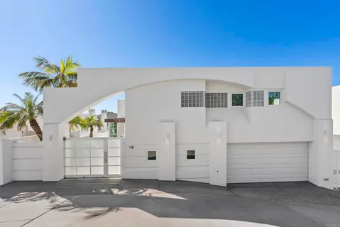 a front view of a house with a garage