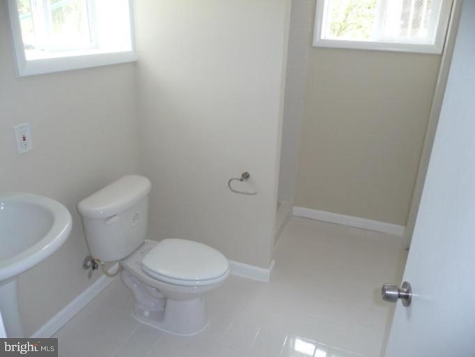 4502 Morgan Road Suitland, MD 20746 - Photo 14 of 14 a white toilet sitting next to a window