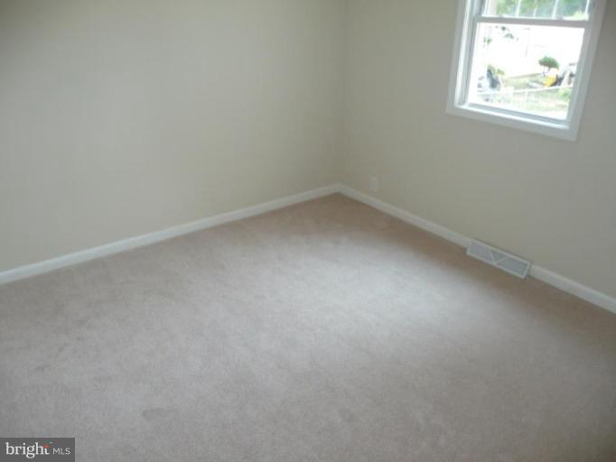 4502 Morgan Road Suitland, MD 20746 - Photo 10 of 14 an empty room with windows