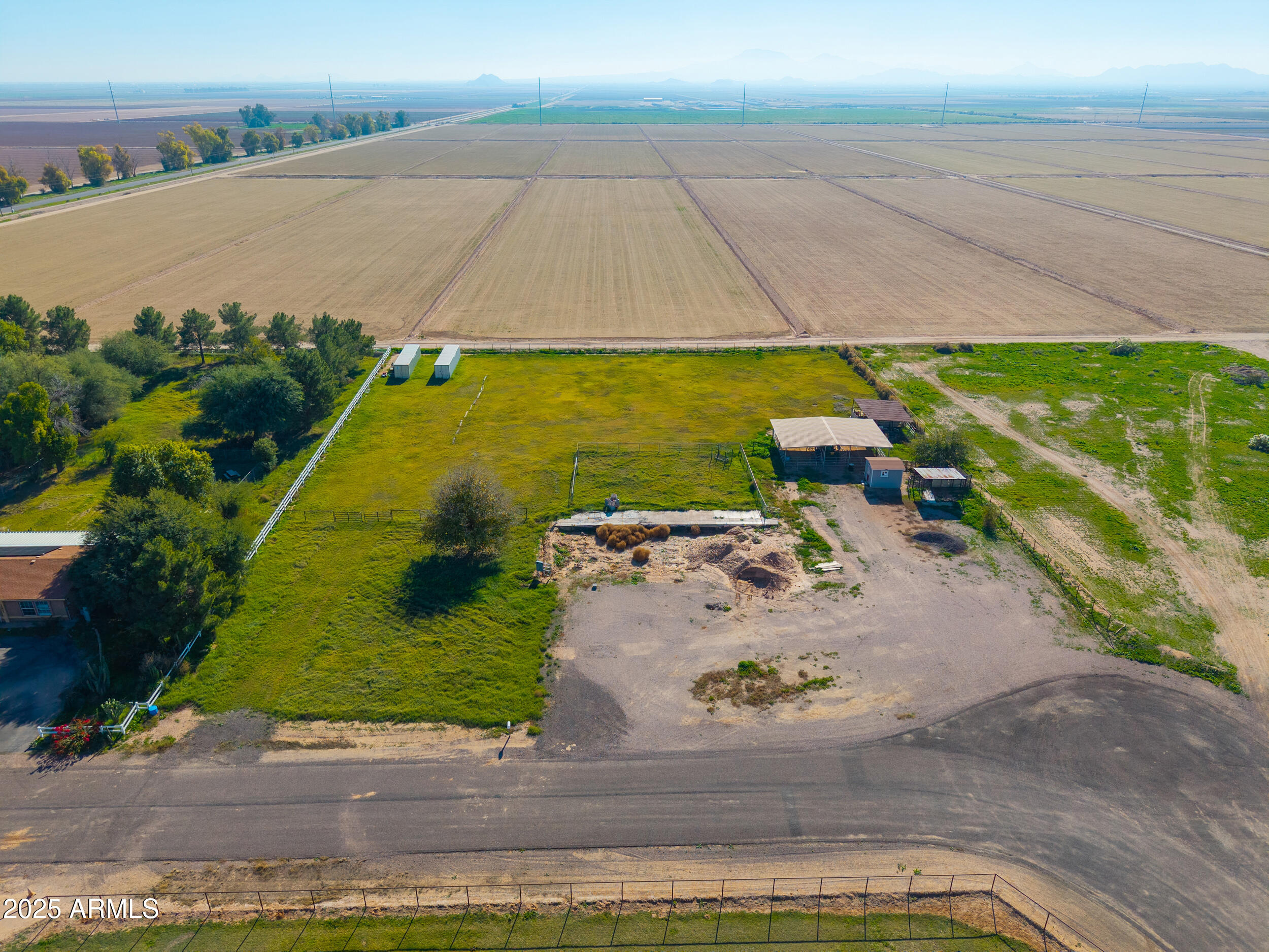 48217 West Quail Run Road, Unit 8 Maricopa, AZ 85139 - Photo 1 of 33 an aerial view of a house with a yard