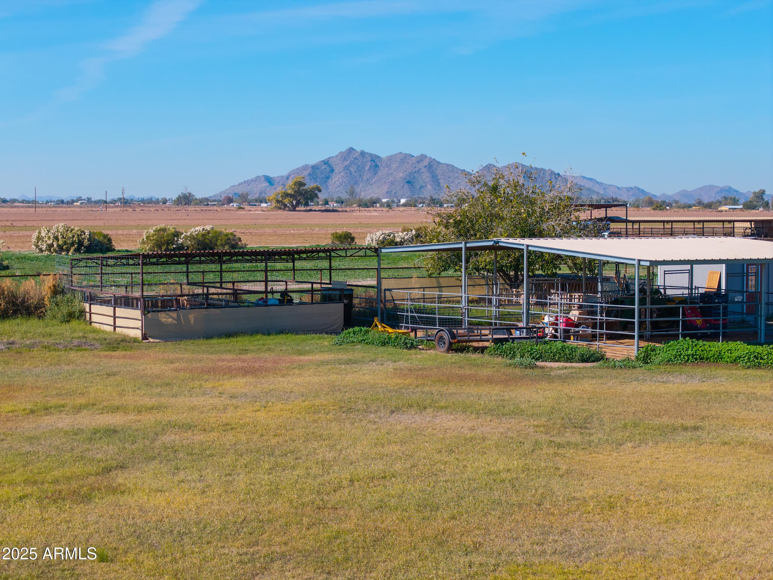 48217 West Quail Run Road, Unit 8 Maricopa, AZ 85139 - Photo 14 of 33 a view of a lake with a mountain in the background
